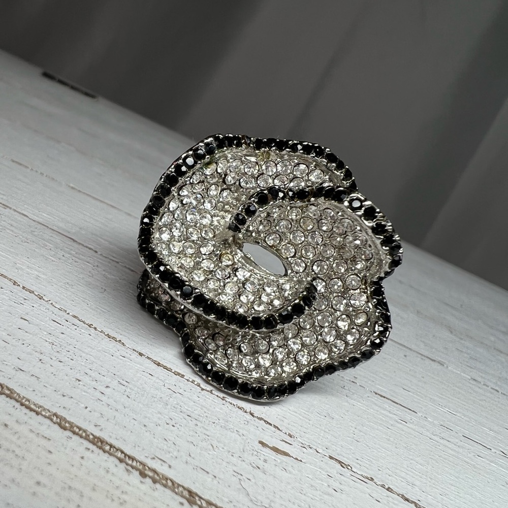 Silver toned cocktail ring with black and clear stones Like New!